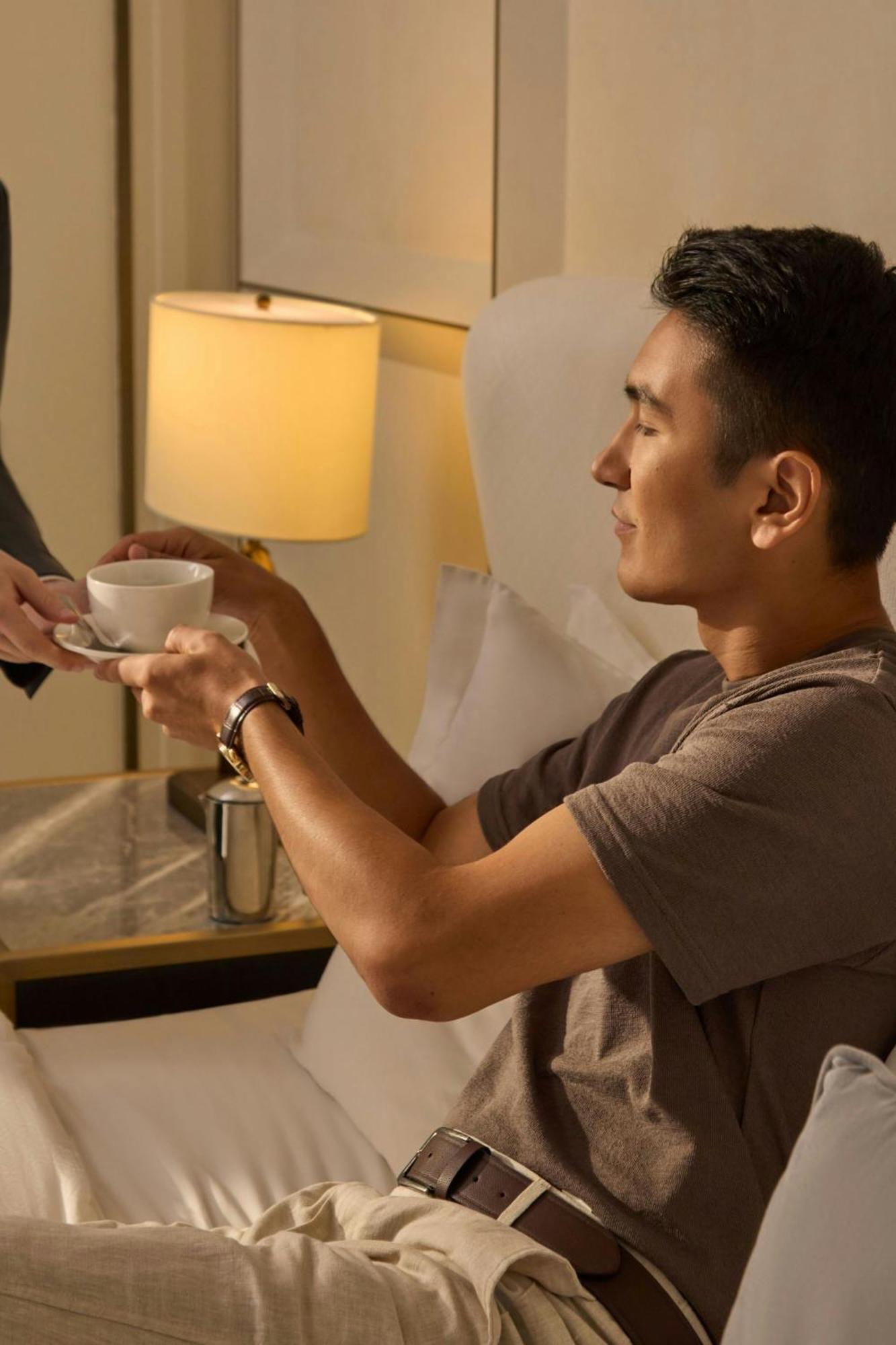 The St. Regis Astana Exterior foto A guest being served coffee