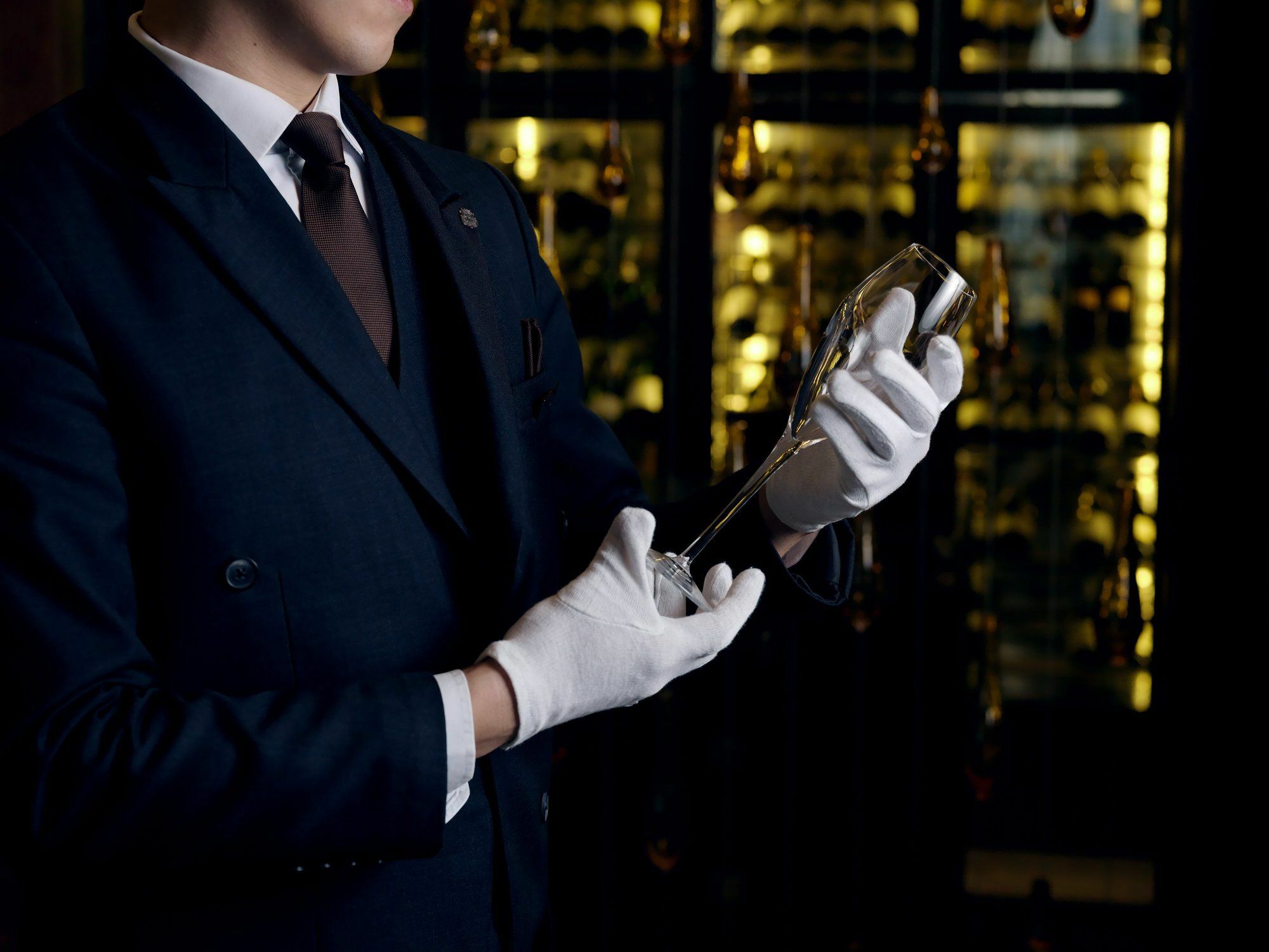 The St. Regis Astana Exterior foto A sommelier inspecting a bottle of wine
